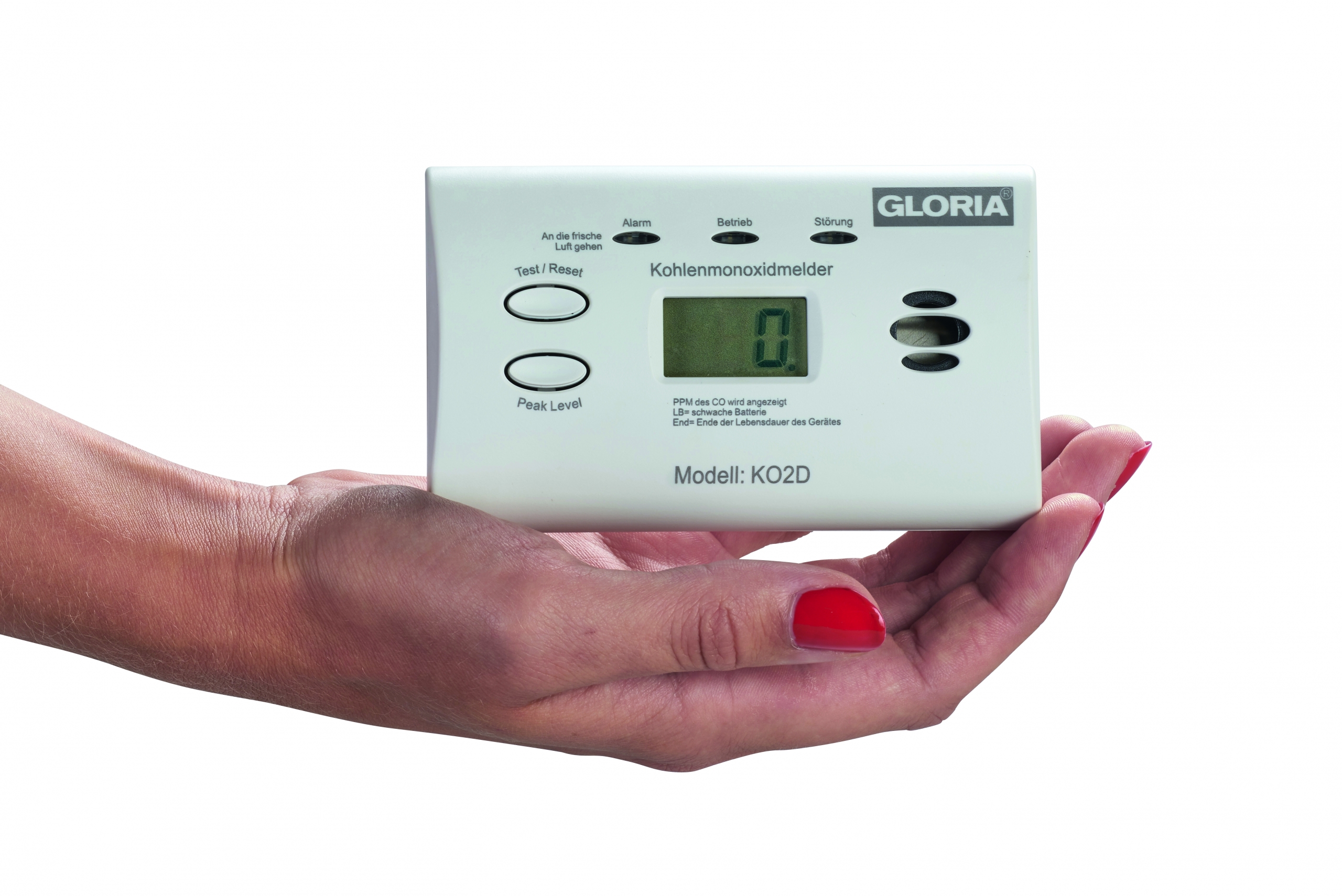 Weißer Kohlendioxidmelder der Firma GLORIA, Model KO2D gehalten in einer flachen Damenhand.